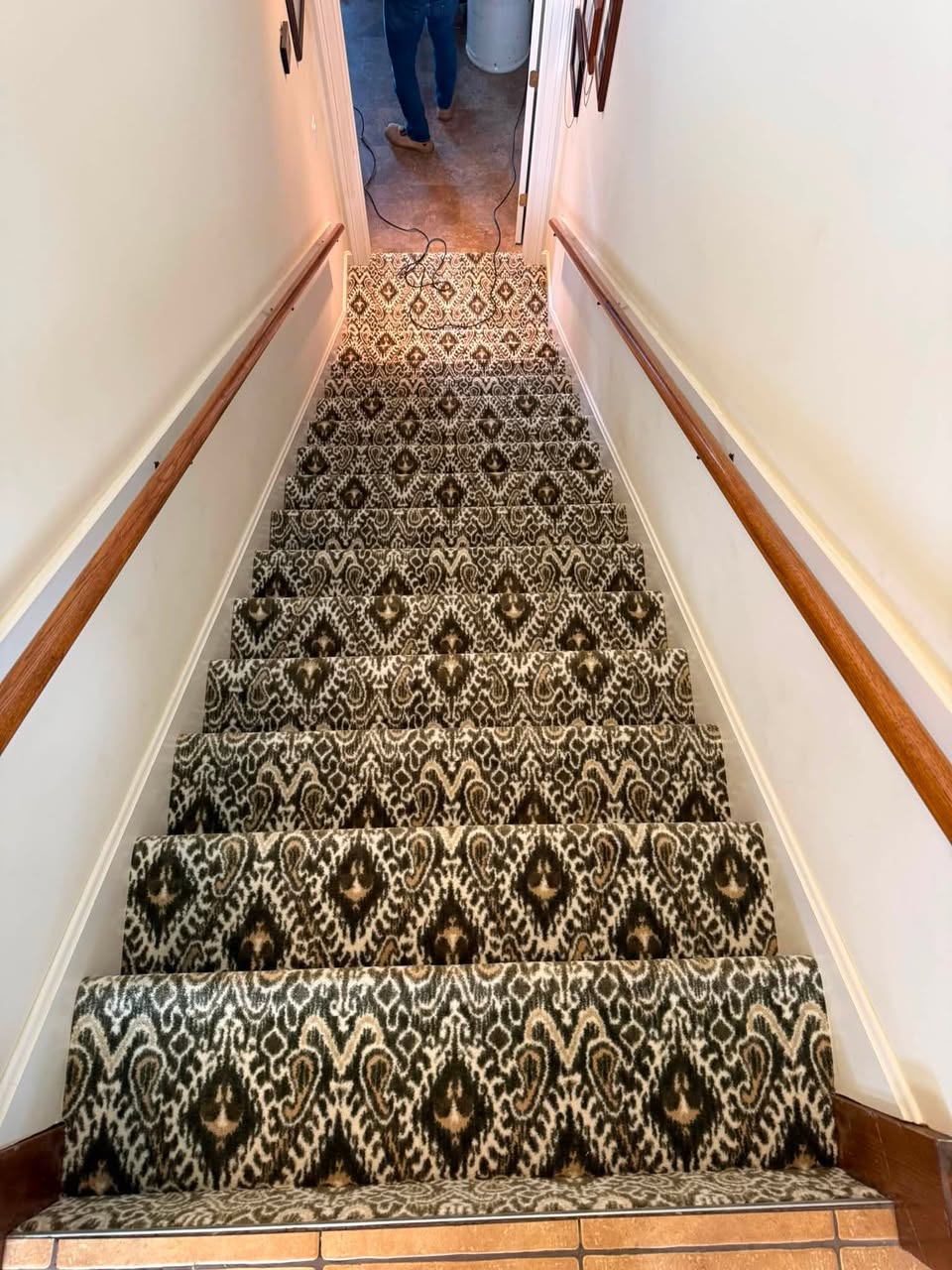 A stair runner project in progress, mid-project, on a Johnson & Co. Flooring job site.