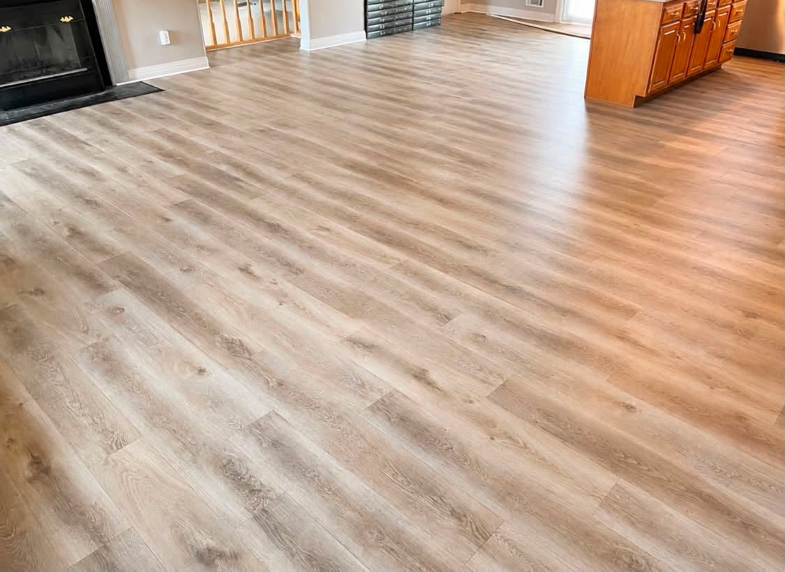 Wood-look laminate flooring in an open living room.