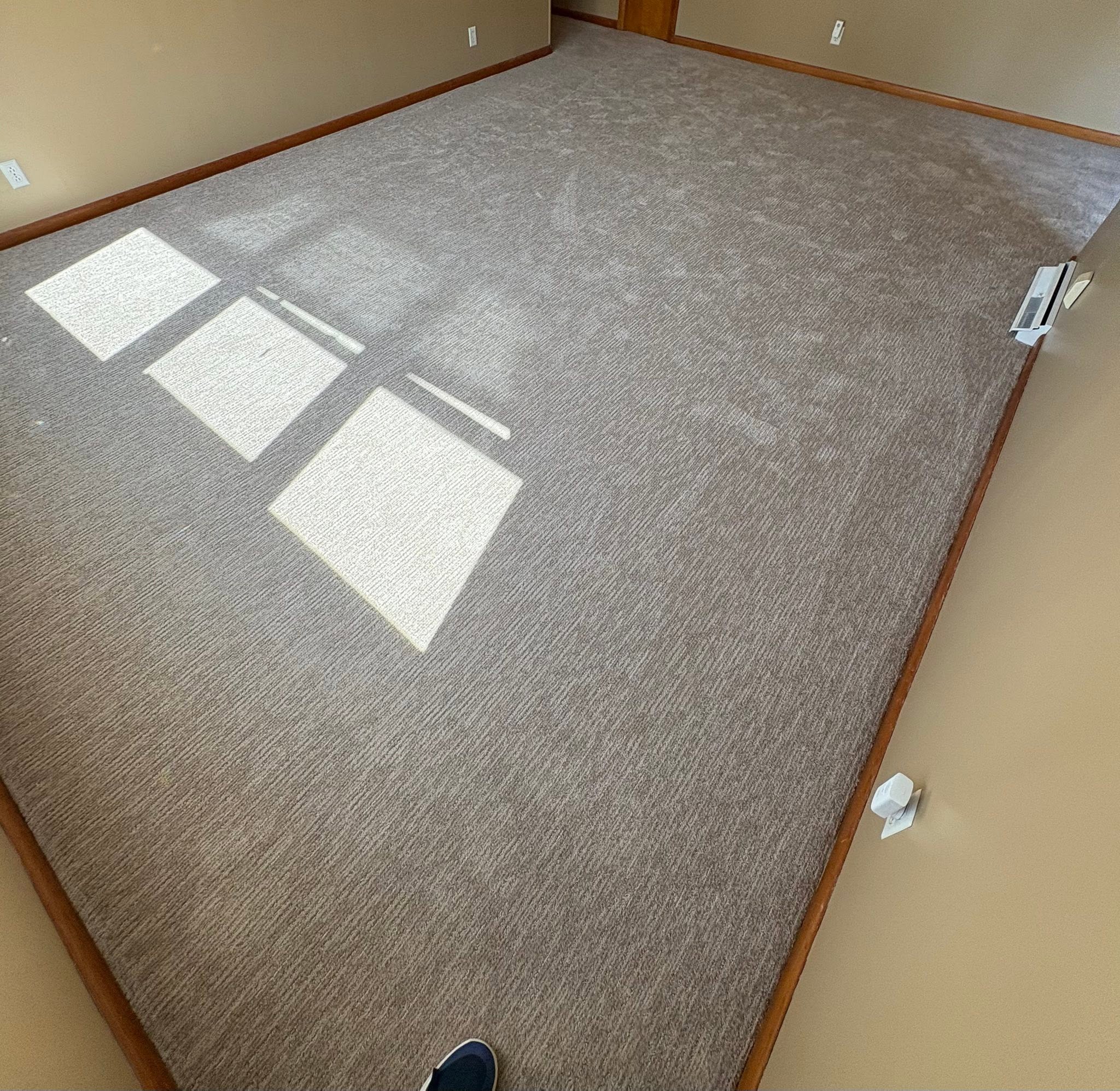 Soft taupe textured carpet in a bedroom.