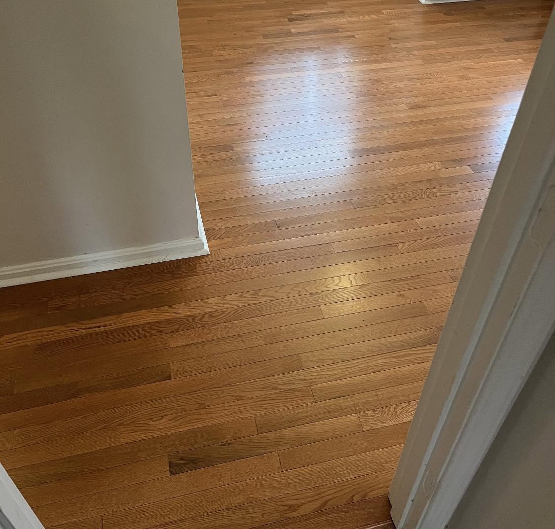 Glossy classic strip oak hardwood flooring.