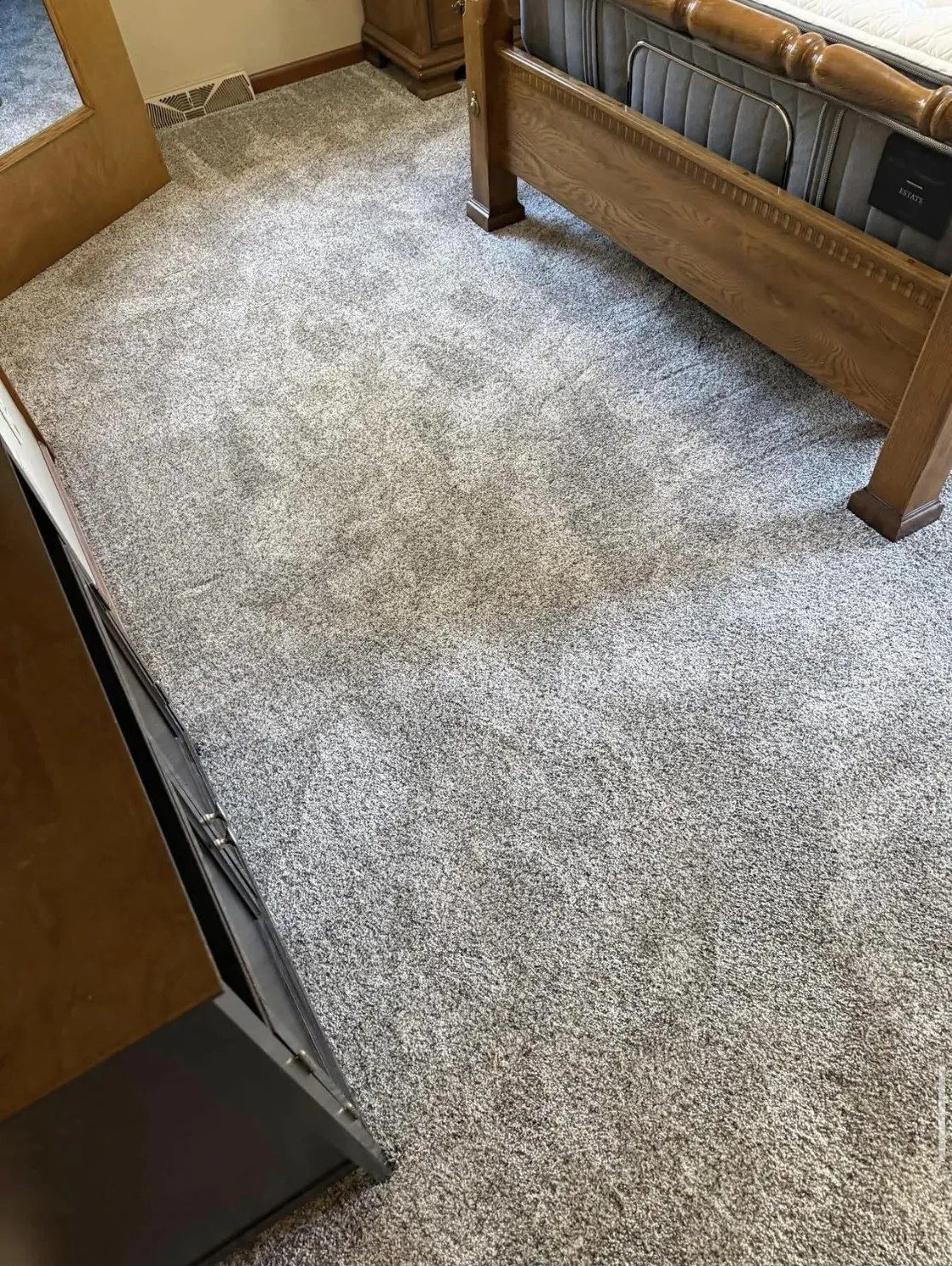 Fulfillment carpet in the color Waterfall, in a bedroom.