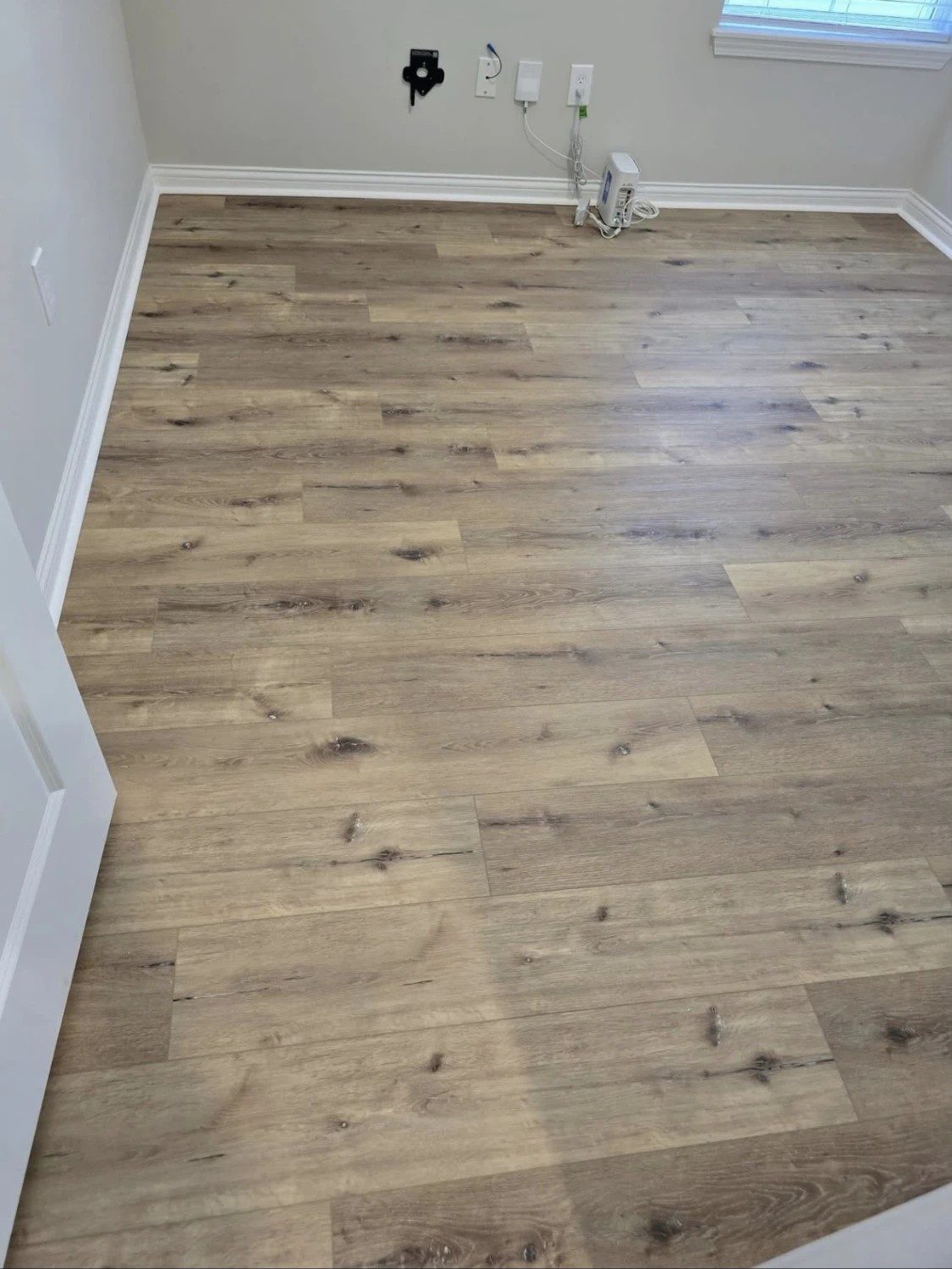 Illusion Oak by Aerocore, in a bedroom.