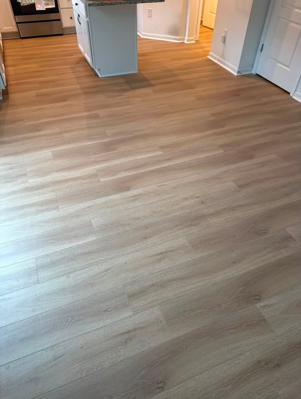 Wood-look vinyl plank flooring in a kitchen.
