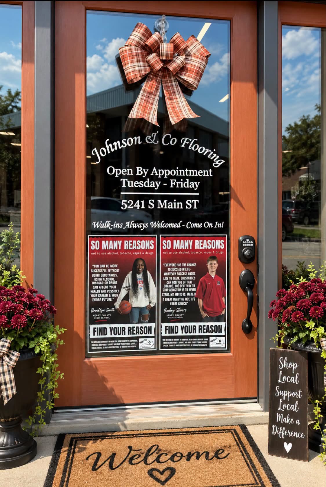 The Johnson & Co. Flooring front door, with hours, address, and a Walk-ins Always Welcomed sign.