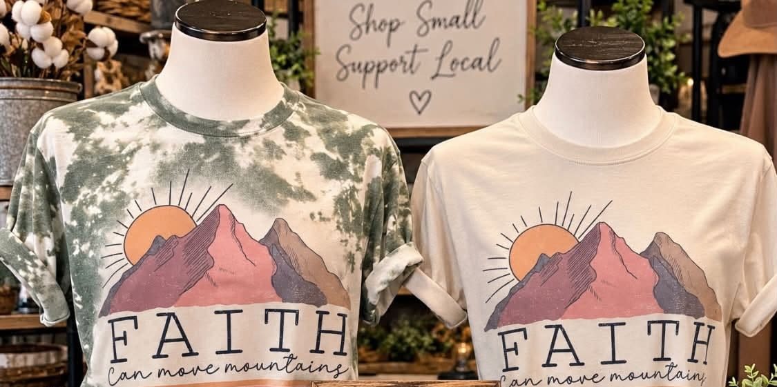 Faith Can Move Mountains graphic t-shirts in two colorways.