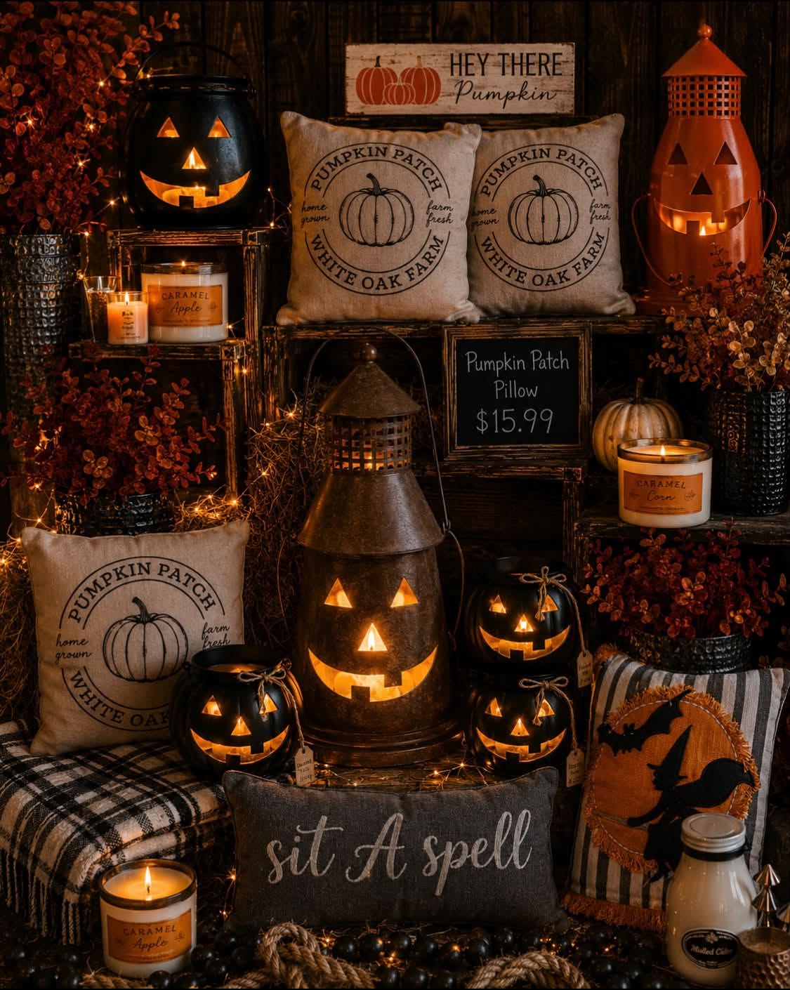 A Halloween display of Pumpkin Patch pillows, jack-o-lantern lanterns, and fall candles.