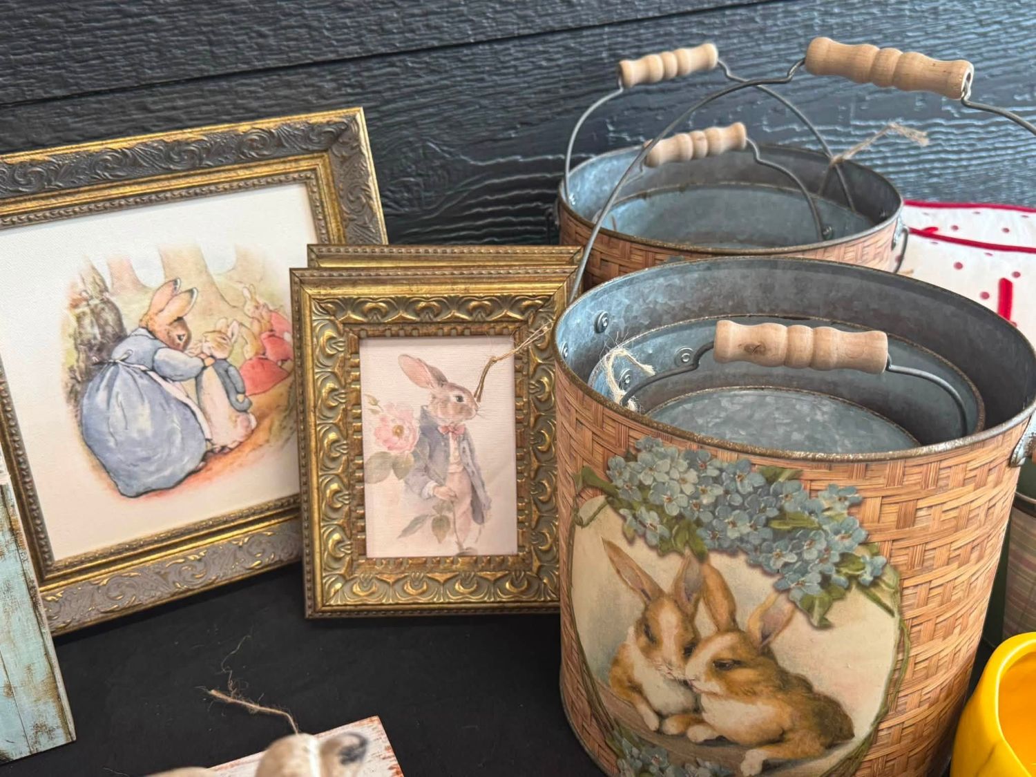 Framed Peter Rabbit prints next to woven Easter buckets.