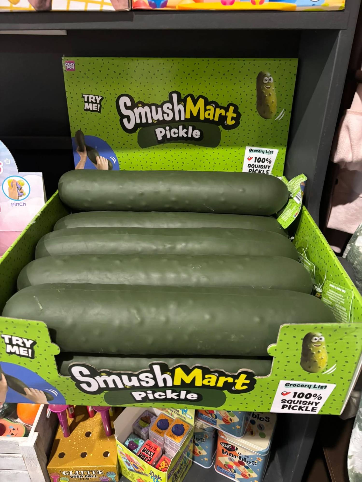 SmushMart Pickle squishy toys on display.